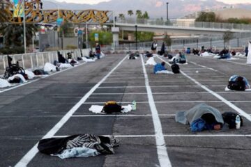 In Las Vegas, Homeless People Sleep 6 Feet apart in Parking Lot as Thousands of Hotel Rooms Sit Empty