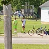 Boys Hop Off their Bikes to Pay Respects during Veteran’s Funeral