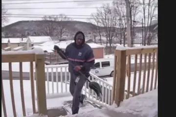 A Mail Carrier Is Shoveling Snow for a Disabled Veteran